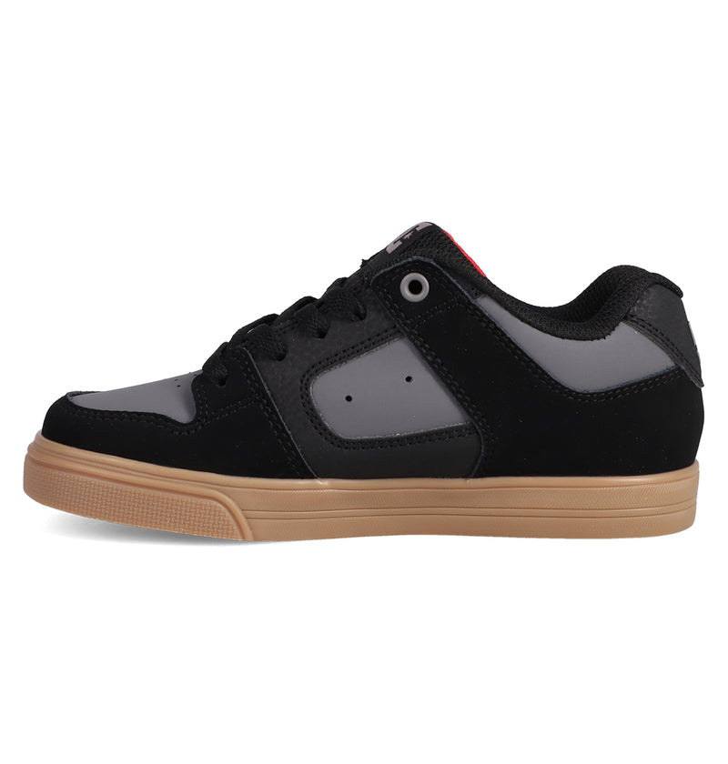 The Kids' Pure Shoes by DC Shoes feature a black and gray skate-inspired design with a gum-colored sole, black laces, and a low-top profile—perfect for everyday wear.