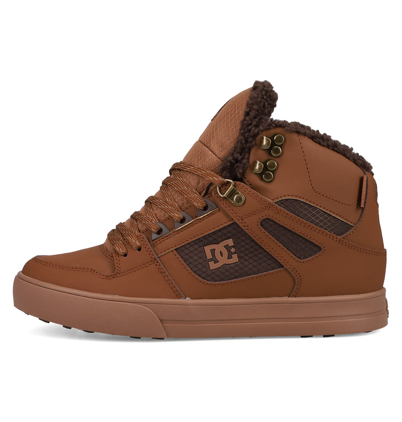 The DC Shoes Men's Pure High Top WC Shoes feature a brown upper, textured vulcanized outsole, metal eyelets, brown laces, padded fuzzy collar, black mesh details, tan midsole, and the DC Shoes logo on the side panel.