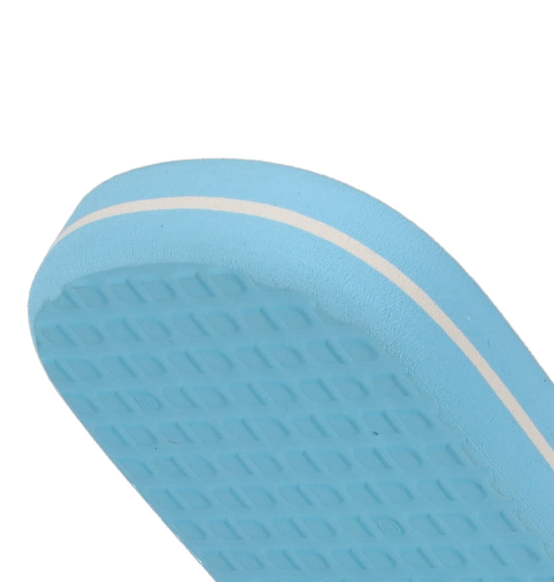 Close-up of the edge and sole of DC Shoes Men's Spray Slides in light blue, featuring a textured bottom and thin white stripe—must-have sandals for any relaxed skate session.