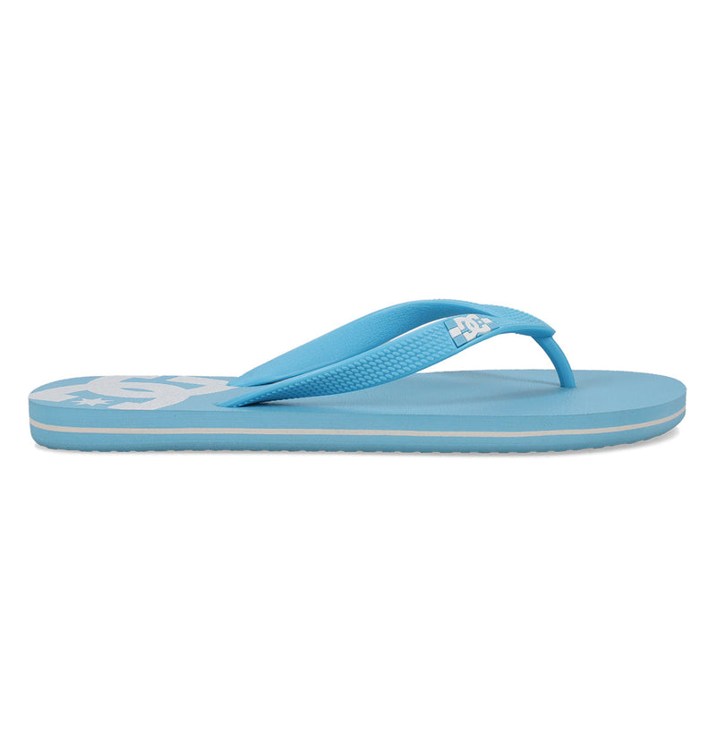 The DC Shoes Men's Spray Slides are light blue with a textured strap, flat sole, and a white logo on the footbed, shown in side profile against a white background.