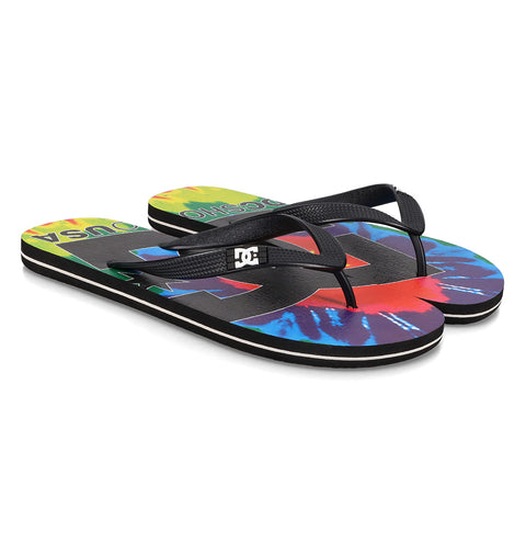 The Men's Spray Graffik Slides by DC Shoes feature black straps, a vibrant tie-dye footbed, and a bold black DC logo—ideal slip-on sandals for relaxing after your next skate session.