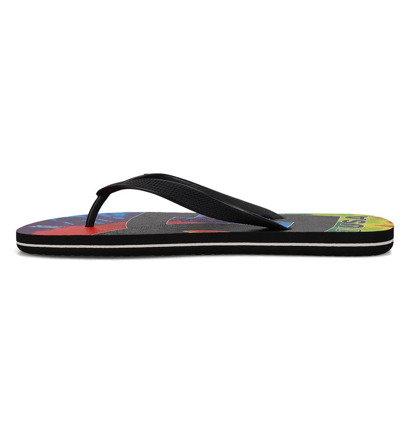 The DC Shoes Men's Spray Graffik Slides feature a black slip-on design with a colorful abstract footbed pattern, shown from the side against a white background—perfect for your next skate session.