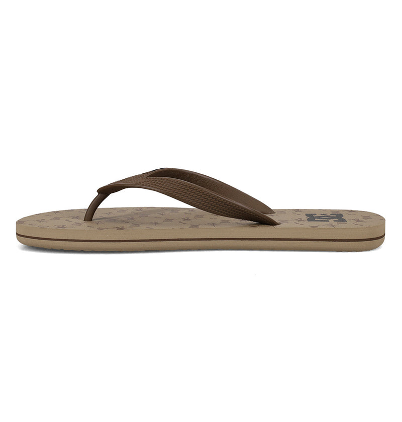 The DC Shoes Men's Spray Graffik Slides feature a brown textured strap and beige sole, shown in side profile on a white background—a must-have for any casual skate session.