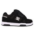 The Men's Stag Shoes by DC Shoes are shown in side profile against a white background, featuring a black upper with a white side logo, black laces, and a thick white and black cupsole—ideal for skate culture enthusiasts.