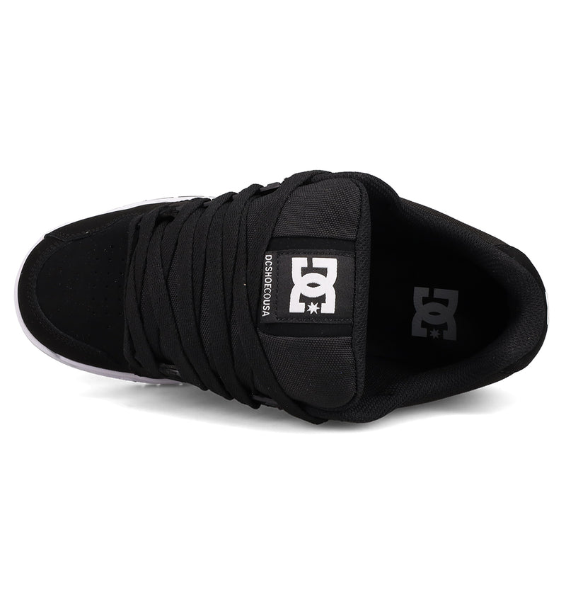 Top view of DC Shoes Men's Stag with thick black laces, a white logo on the tongue, signature cupsole construction, padded collar, and a partially visible white outsole at the toe.
