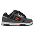 The Men’s Stag Shoes from DC Shoes are gray and black skate shoes featuring a red DC logo on the side, black laces, and a white and black sole. Designed with cupsole construction for enhanced durability, these low-profile sneakers offer padded support, perfectly embodying classic skate culture style.
