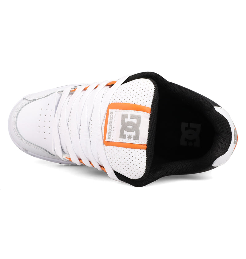 Top view of the Men's Stag Shoes by DC Shoes—white with a black inner lining, orange and gray accents, perforated tongue, durable cupsole, and DC logo on the tongue and insole—ideal for skate culture enthusiasts.