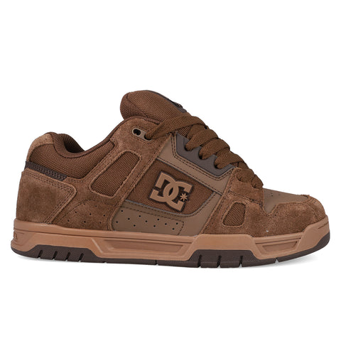 The DC Shoes Men's Stag features brown suede and leather uppers, black accents, brown laces, the DC logo on the side, and classic cupsole construction. Shown in side profile on a white background.