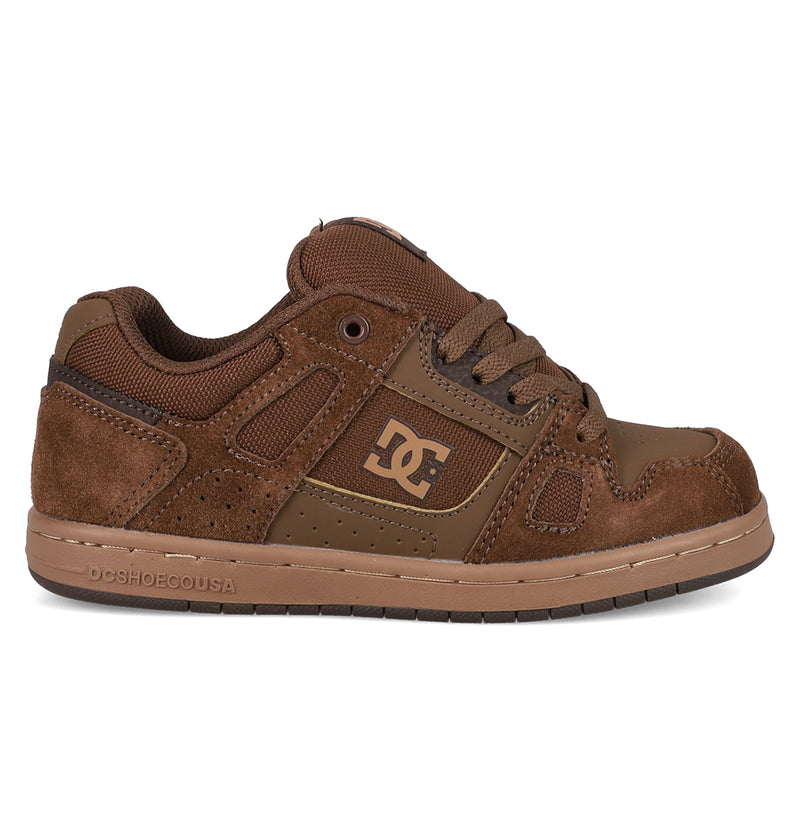 The Kids' Stag Shoes by DC Shoes feature brown suede and leather panels, perforated details, brown laces, and a tan DC logo on the side. Durable cupsole construction makes them ideal for young skate culture fans.