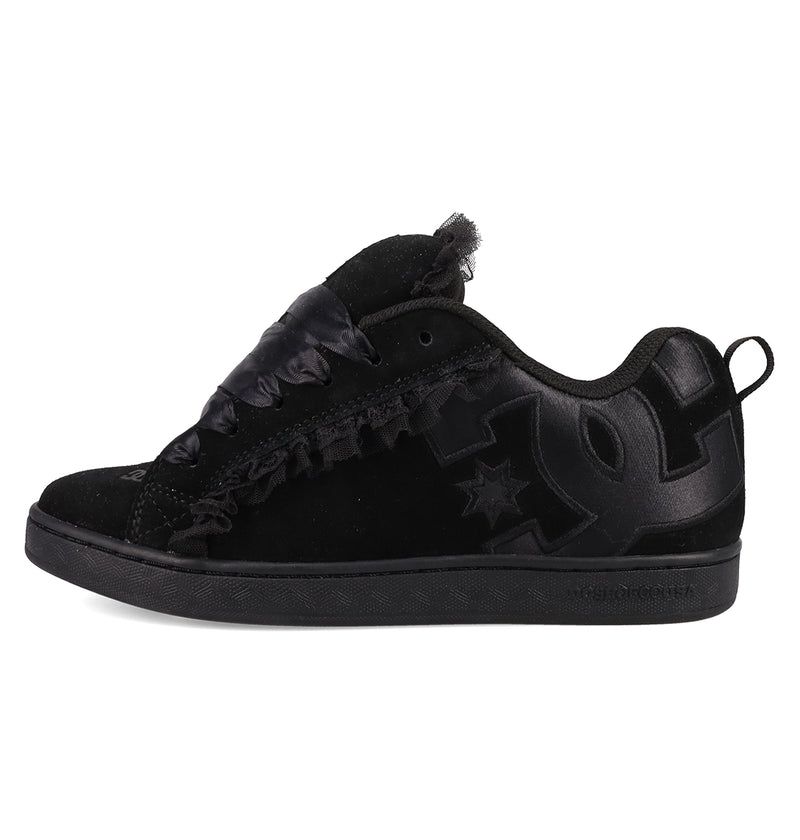 The Women's Court Graffik SD Shoes by DC Shoes feature a black suede upper, leather accents, large textured side logo, satin-style laces, low-top design, puffy silhouette, and an all-black sole for a sleek look.