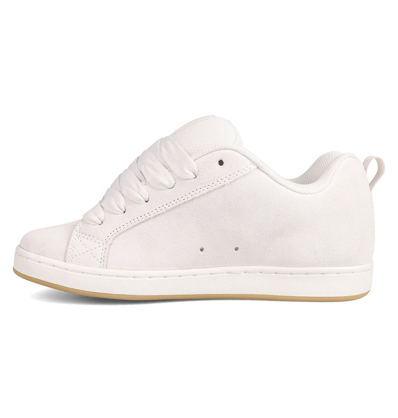 The Women's Court Graffik SD Shoes by DC Shoes feature a white suede upper, thick laces, and a light tan rubber sole with a puffy silhouette, shown in side profile against a white background.