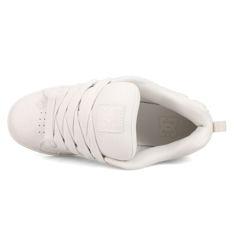 Top view of the Women's Court Graffik SD Shoes by DC Shoes, featuring a white suede upper, thick laces, padded tongue, textured detailing, and visible DC logo on the tongue and side.