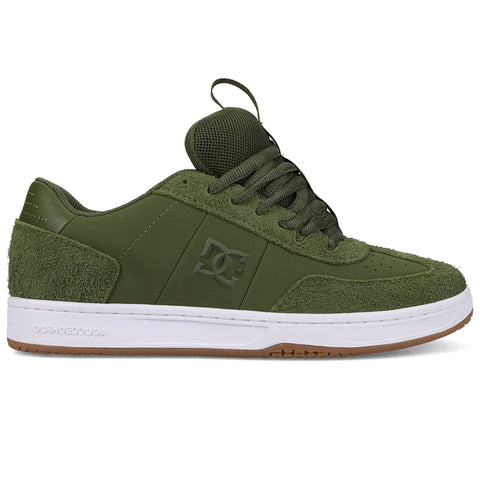 The DC Shoes Men's Astrix features an olive green suede and leather upper, mesh tongue, dark green laces, white sole with brown gum bottom, and embossed DC logo for board control style.