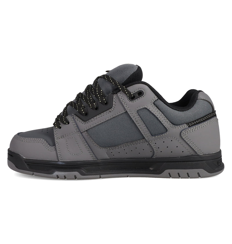 The DC Shoes Men's Stag Shoes are gray skate-inspired sneakers with black accents, black laces with white speckles, a durable cupsole, perforated sides for ventilation, padded collar and heel for all-day comfort.