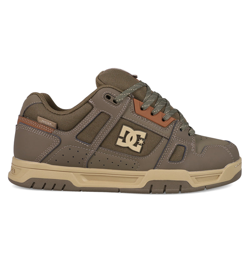 The DC Shoes Men's Stag Shoes feature a brown and tan design, chunky cupsole, perforated details, lace-up front, smooth and textured panels, and the iconic DC logo—ideal for authentic skate style.
