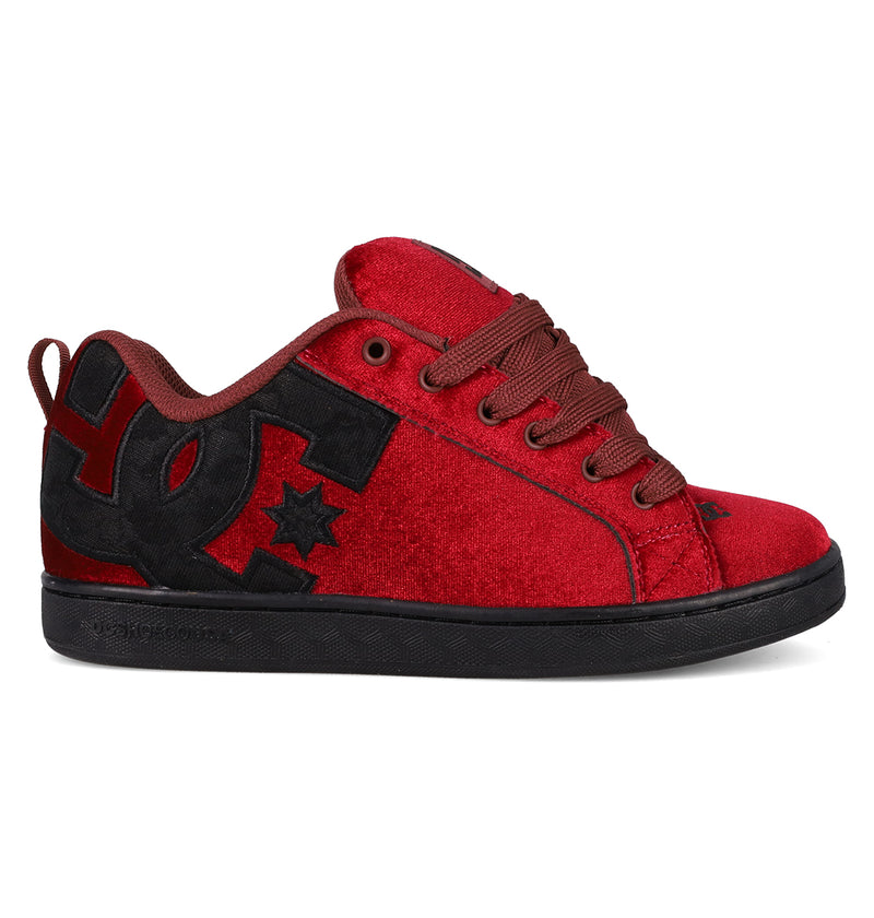 The Women's Court Graffik LE Shoes by DC Shoes feature a low-top puffy red suede upper with black accents, a black DC logo and sole, red laces, premium materials, and a star detail near the logo.