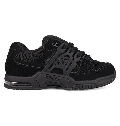The Men's AT-2 Shoes by DC Shoes feature a black skate design with dark gray accents, mesh and suede uppers, a thick padded tongue, chunky sole, DC logo on the side, and AEROTECH branding to showcase its breathable AEROTECH ventilation system.