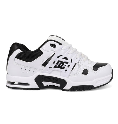The Men's AT-2 Shoes by DC Shoes are white and black athletic sneakers featuring mesh detailing, a black sole with AEROTECH ventilation, TPU cage support, visible heel cushioning, DC logos on the side, and white laces.