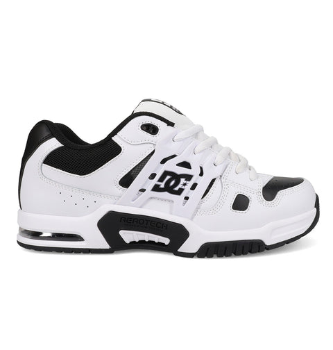 The Men's AT-2 Shoes by DC Shoes are white and black athletic sneakers featuring mesh detailing, a black sole with AEROTECH ventilation, TPU cage support, visible heel cushioning, DC logos on the side, and white laces.