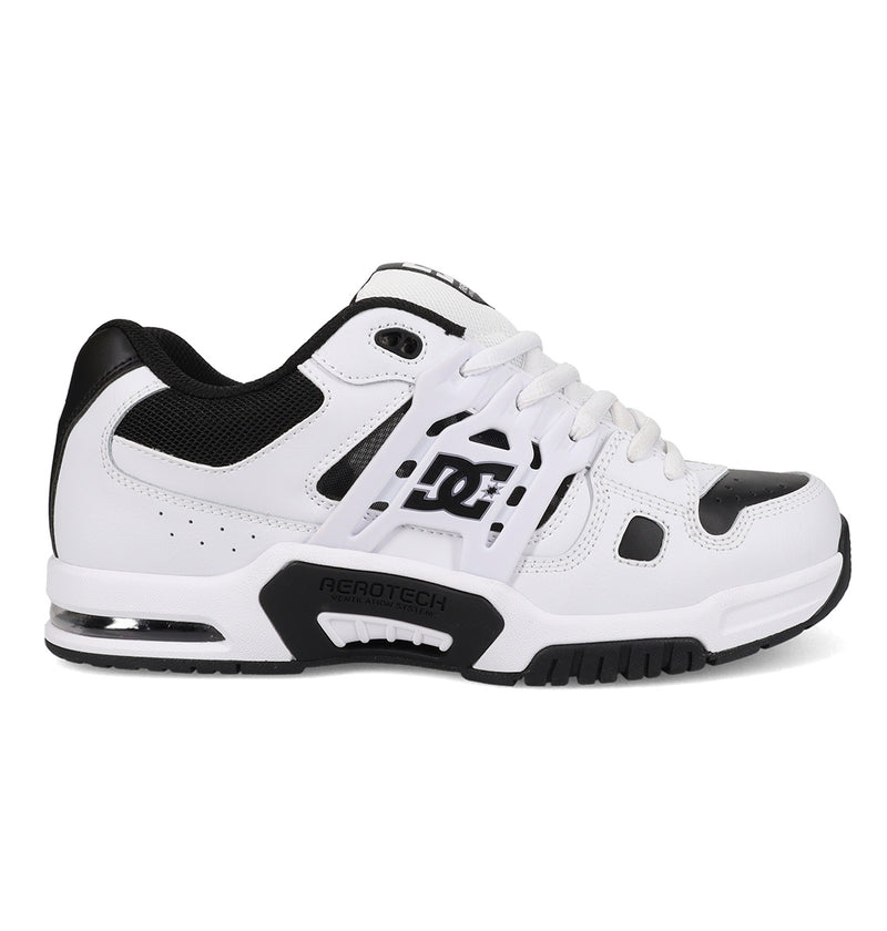 The Men's AT-2 Shoes by DC Shoes are white and black athletic sneakers featuring mesh detailing, a black sole with AEROTECH ventilation, TPU cage support, visible heel cushioning, DC logos on the side, and white laces.