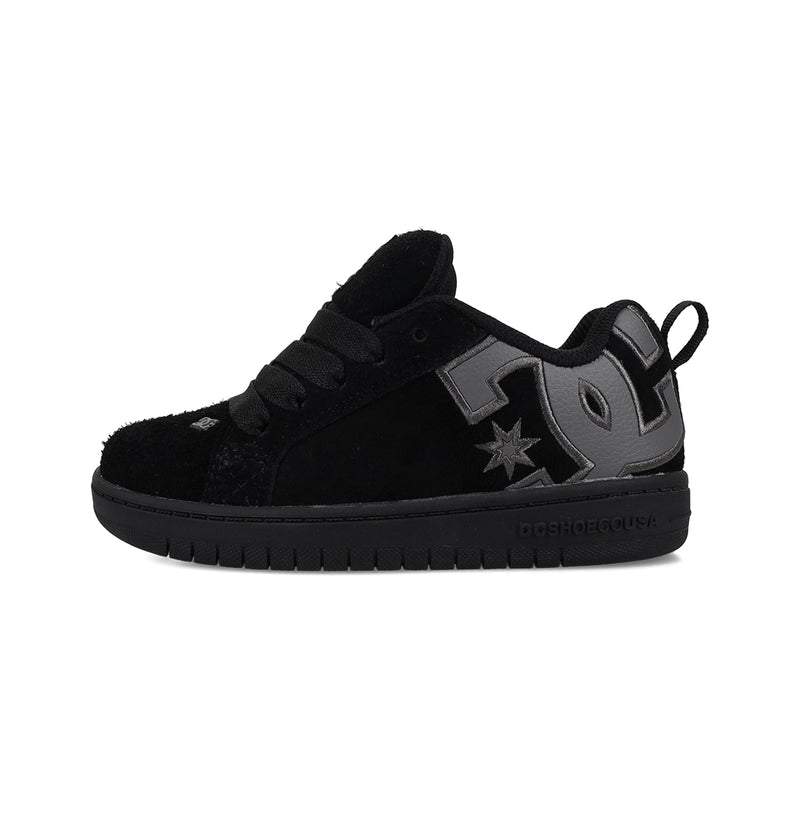 The Kids' Court Graffik Special Edition Shoes by DC Shoes are black skate shoes with a thick sole, black laces, and a large dark gray DC Shoes logo on the side—ideal for casual wear or skateboarding.