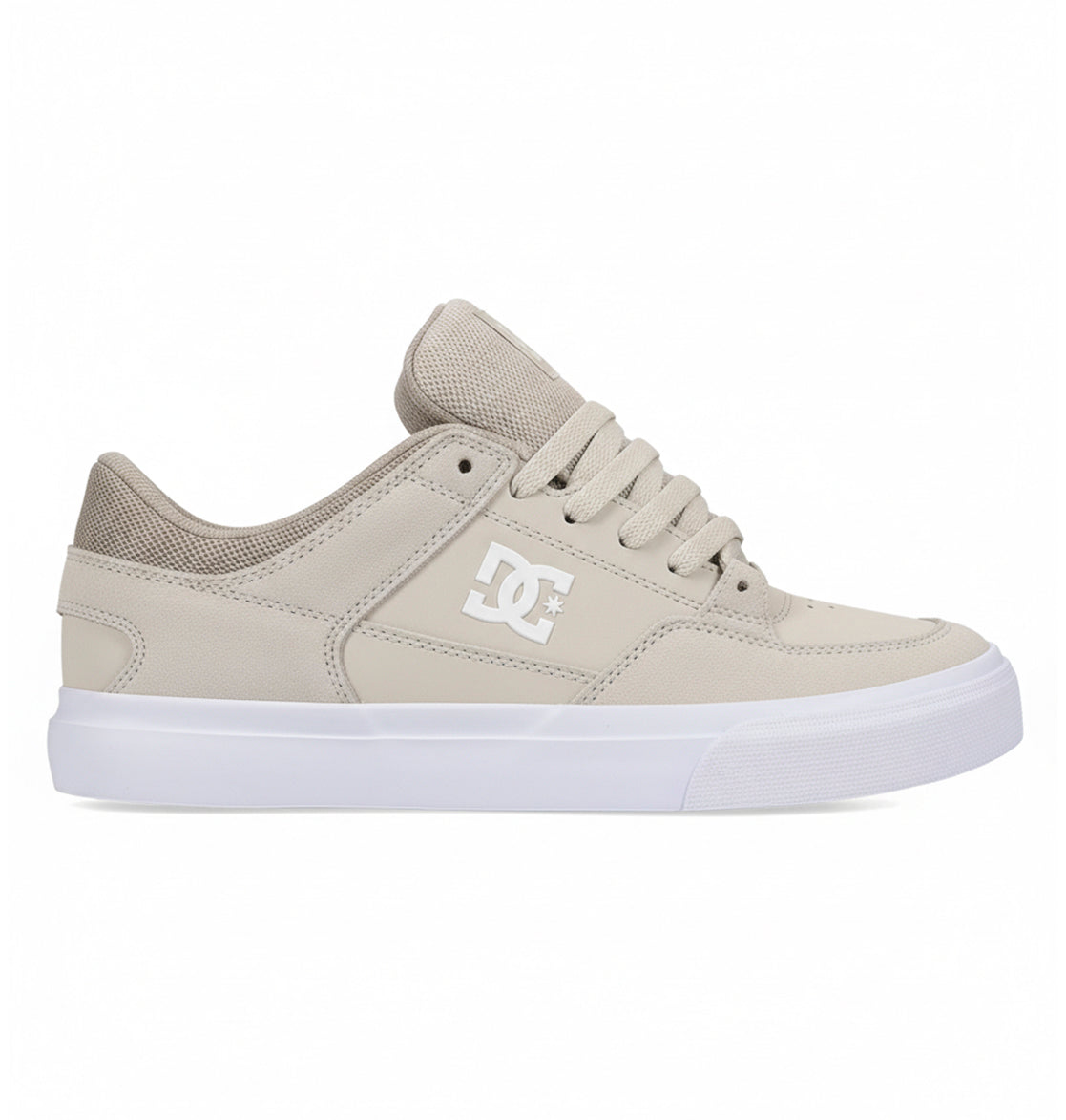 Men’s Onyx Skate Shoes by DC Shoes—featured in beige with a white sole, mesh tongue, and padded collar—shown in a side profile on a white background. This everyday go-to vulcanized sneaker delivers a minimal silhouette ideal for effortless street style.