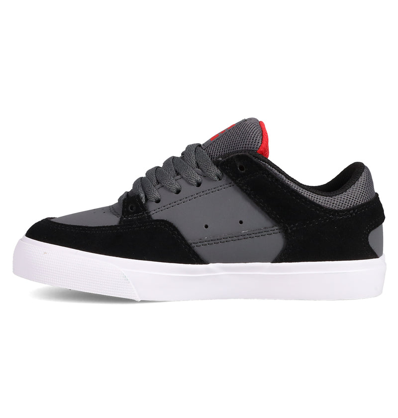 The DC Shoes Kids' Onyx Shoes are black and gray low-top vulc sneakers with a white sole, gray laces, mesh fabric, and a touch of red on the tongue—perfect everyday footwear in stylish Onyx colors, shown from the side.