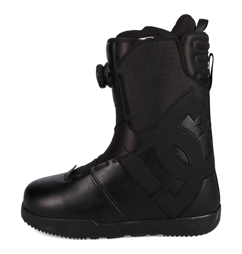 Introducing the Men's Court Graffik BOA® Snowboard Boots by DC Shoes: a black, skate-inspired snowboarding boot with a textured side and a prominent embossed logo. Featuring the BOA Fit System dial closure, these boots offer rugged soles and ankle padding for enhanced durability and support during snow sports.