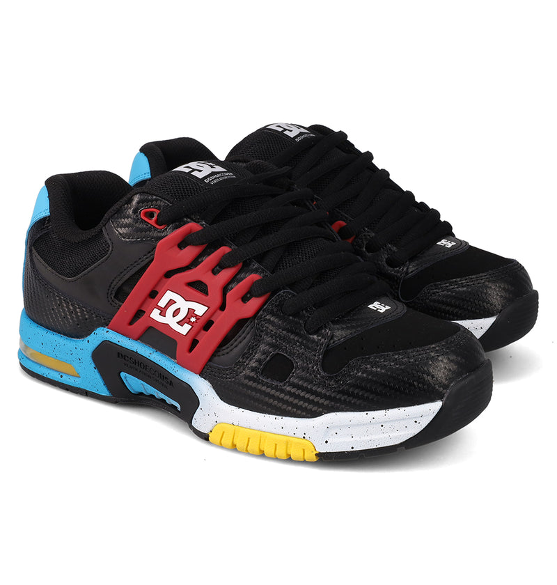 The DC Shoes Men's AT-2 features black textured uppers, red lace cages, blue heel and sole accents, yellow on the outsole, a white speckled midsole, and AEROTECH ventilation for all-day breathable comfort.