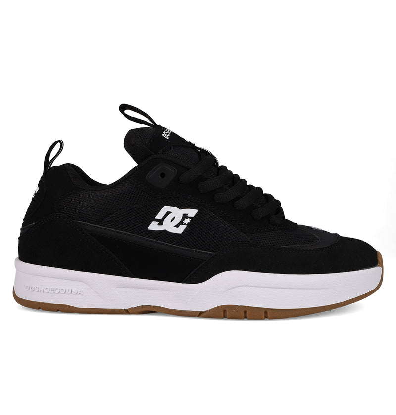 The DC Shoes Men's JS-2 Shanahan Pro Skate Shoes feature a black upper, white side logo, black laces, thick white midsole, and brown rubber outsole. Inspired by John Shanahan and shown on a plain white background.