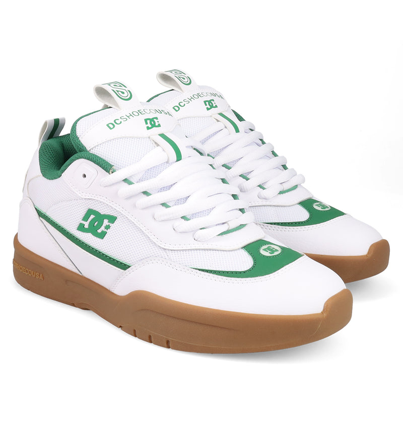 The Men's JS-2 Shanahan Pro Skate Shoes by DC Shoes feature a white and green design with gum soles, white laces, branded logos on the sides, tongue, toe, and green accents, showcasing DC heritage inspired by John Shanahan.