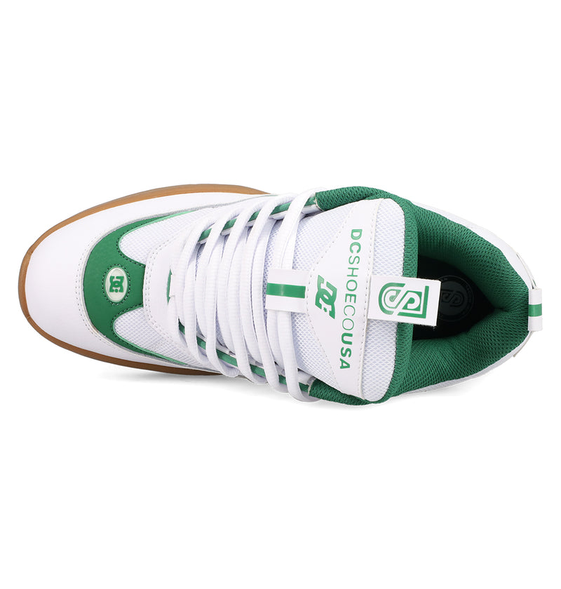 Top view of DC Shoes Men's JS-2 Shanahan Pro Skate Shoes in white and green, featuring white laces, a brown rubber sole, DC branding, heritage accents, and a small DC logo near the toe. Inspired by John Shanahan.