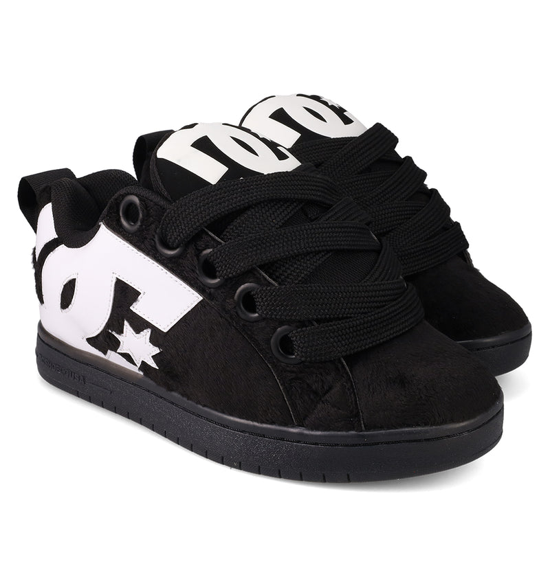 The DC Shoes Men's Court Graffik Puff Shoes are black, low-top skate shoes with a puffy silhouette, thick black laces, white DC logos on the sides, a textured finish, and flat black soles.
