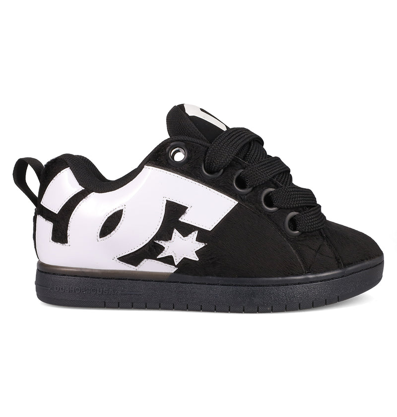 The Men's Court Graffik Puff Shoes by DC Shoes feature a puffy black and white silhouette with a bold white DC logo and star on the side, black laces, an exaggerated upper, and a black sole, shown in a side view.