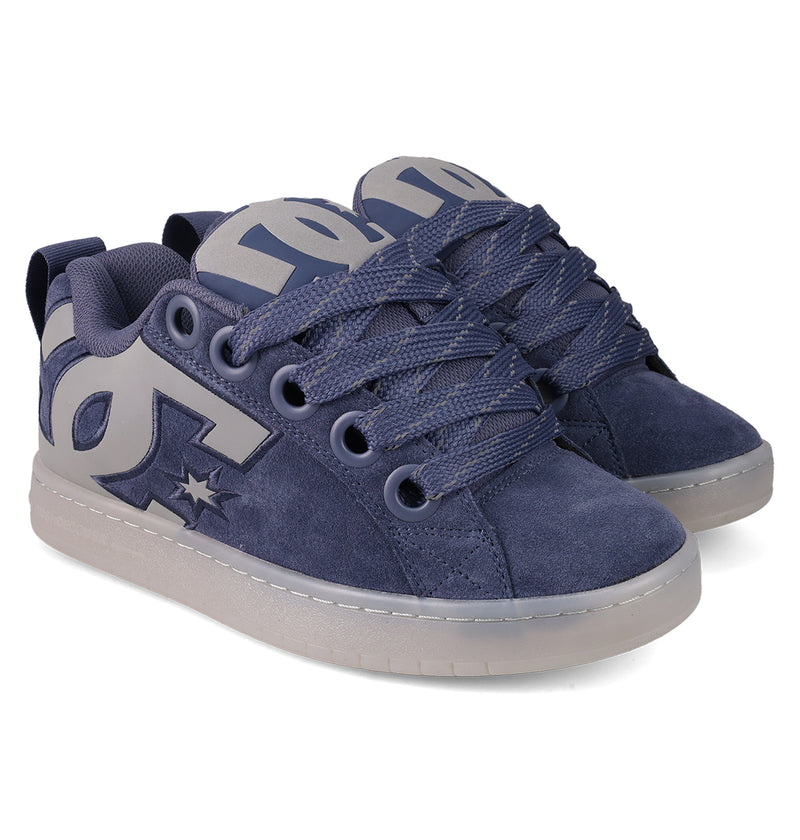 The Men's Court Graffik Shoes from DC Shoes feature a puffy navy blue silhouette, thick laces, suede texture, gray soles, and a bold DC logo—offering classic skate style.