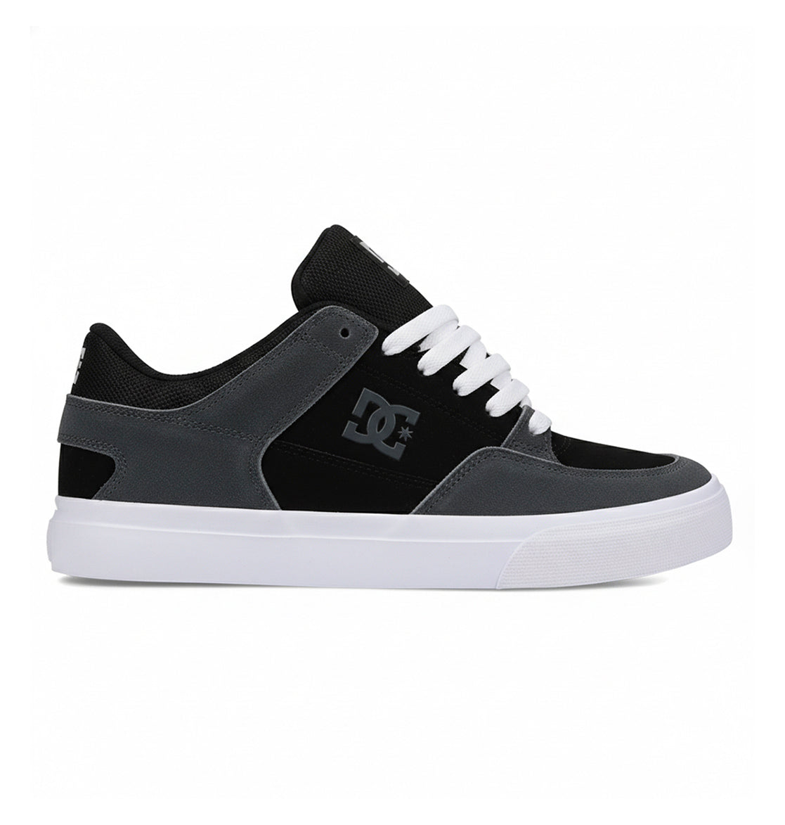 The Men's Onyx S Shoes by DC Shoes feature a minimal black and grey vulc design with white laces, a white sole, and an Onyx DC logo on the side, displayed against a plain white background.