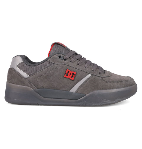 The Men's Fractal SE Shoes by DC Shoes feature a grey suede upper, thick sole, padded collar, grey laces, red DC logo, and black outsole—a low-top design blending street style with all-day performance comfort.