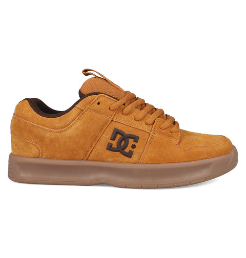 The Men's Lynx Zero SE Shoes by DC Shoes feature tan suede uppers, brown laces and lining, a thick brown rubber sole, and display the iconic DC logo on the side.