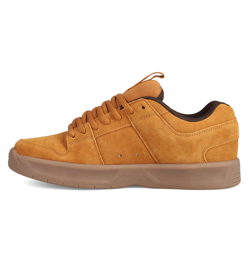 The Men's Lynx Zero SE Shoes by DC Shoes are tan suede low-top skate shoes with brown laces and a thick brown rubber sole, inspired by the DC Lynx Zero, shown from the side on a white background.
