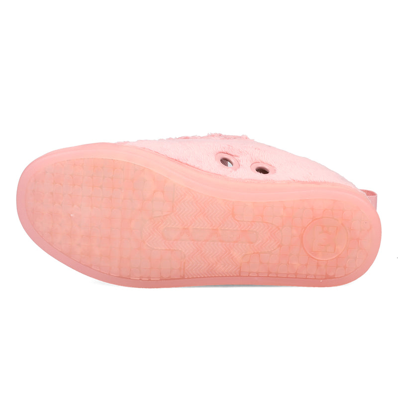 The image shows the sole of a pink Women’s Court Graffik Puff Shoe by DC Shoes facing upward, highlighting its textured grip pattern and two visible eyelets on the upper part—a style characteristic of the brand’s iconic puffy silhouette.