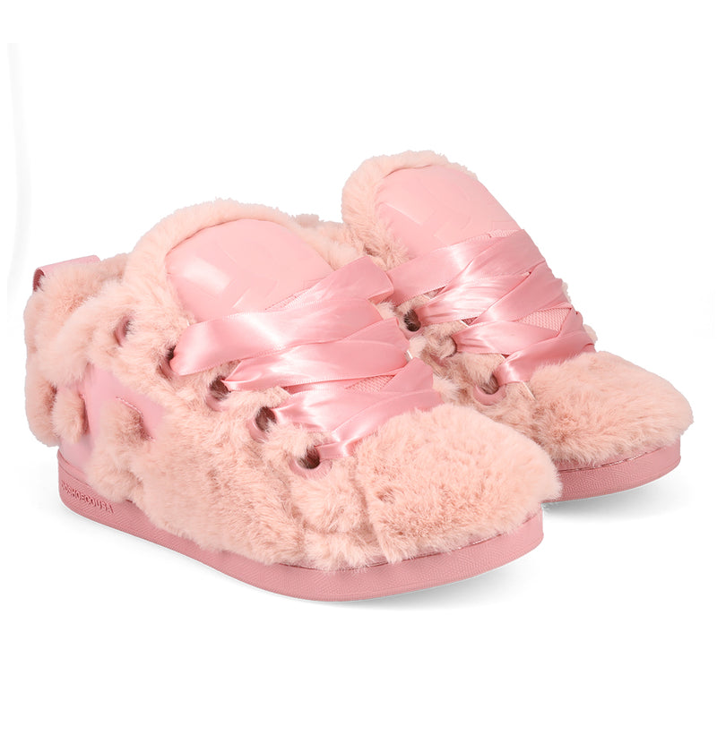 The DC Shoes Women's Court Graffik Puff Shoes feature a puffy silhouette in light pink with fluffy faux fur, shiny satin ribbon laces, and bold upper details, shown against a white background.