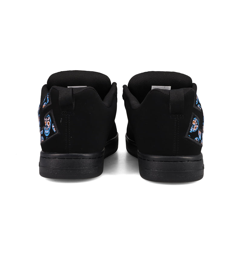 A pair of DC Shoes Men’s Court Graffik Day Of The Dead sneakers in black, viewed from the back, showcasing vibrant Día de los Muertos-inspired decorative designs on the heels against a plain white background, part of the exclusive Day of the Dead Collection.