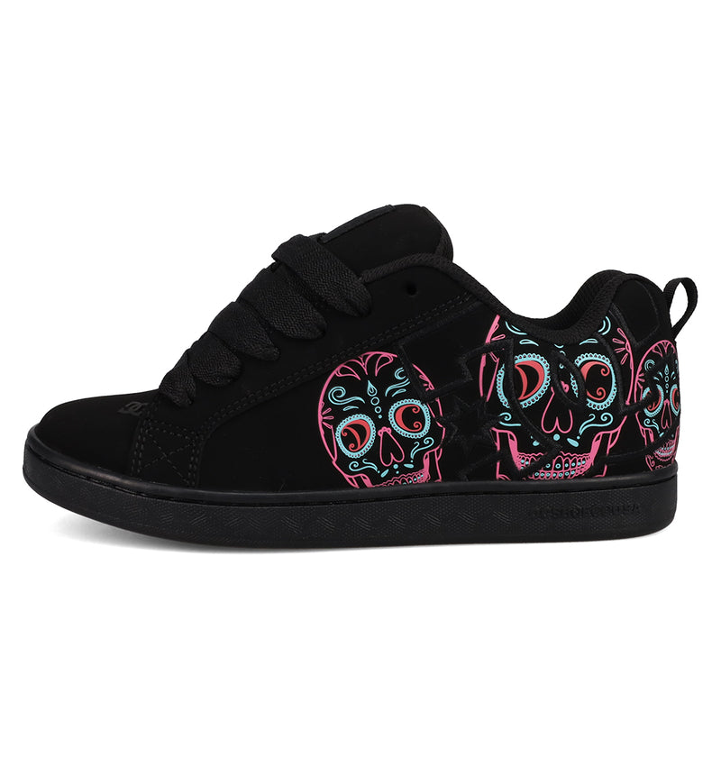 The Women’s Court Graffik Day Of The Dead by DC Shoes is a black sneaker featuring thick laces and vibrant sugar skull designs in pink, teal, and white on the side, inspired by Día de los Muertos and part of the bold DC Shoes Day of the Dead Collection.