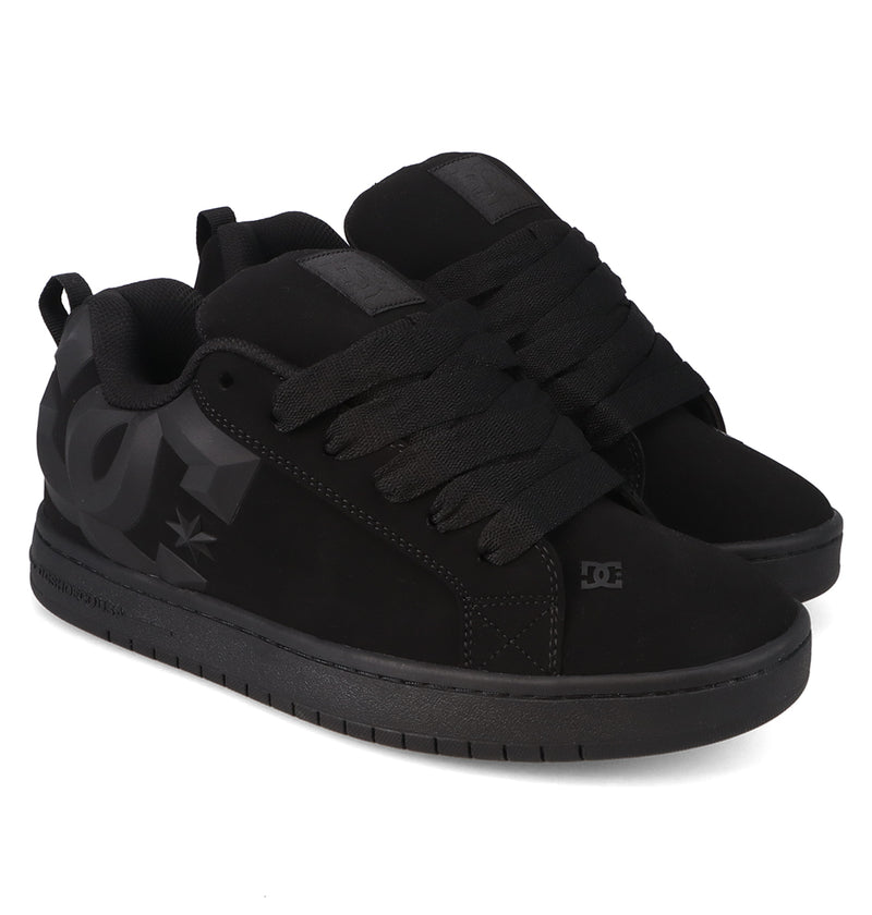 A pair of Men’s Court Graffik Beveled Shoes by DC Shoes, featuring a black puffy silhouette, thick black laces, black soles, and a subtle black logo on the side, displayed on a white background.