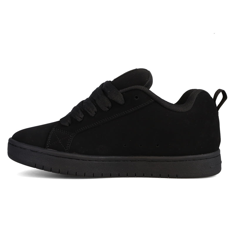 The Men’s Court Graffik Beveled Shoes by DC Shoes are black low-top sneakers featuring a suede-like finish, puffy silhouette, black laces, and a black rubber sole, displayed in a side profile on a plain white background.