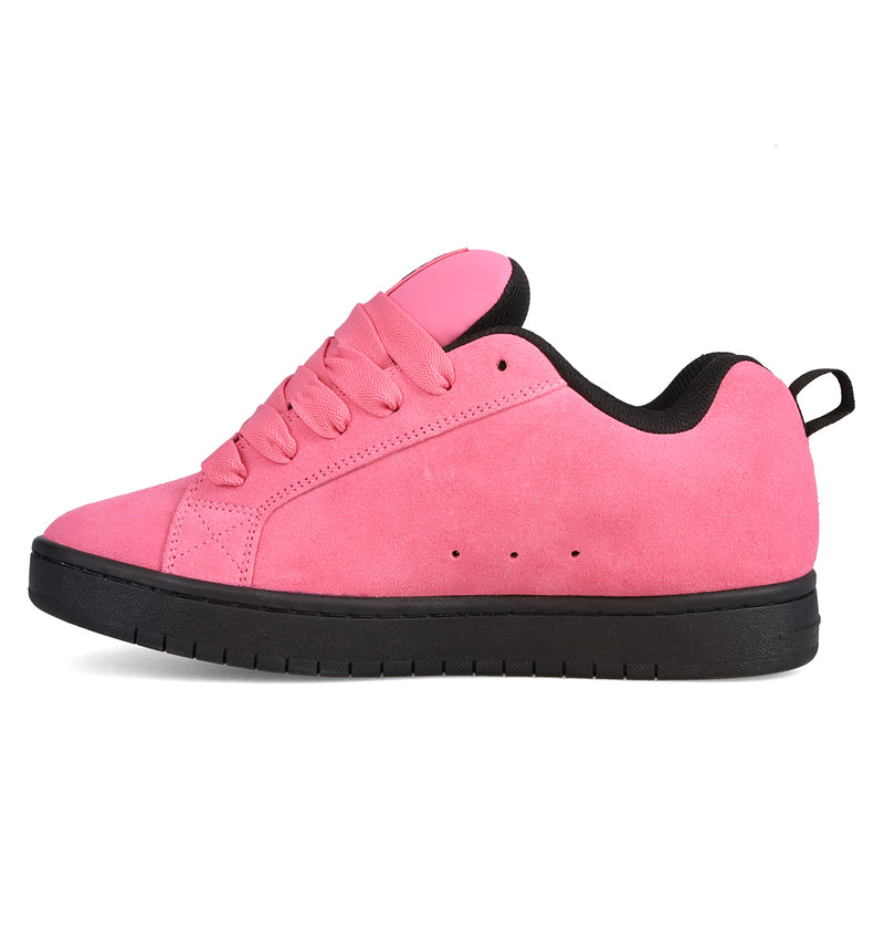 Showcased in a left side profile against a crisp white background, the Men’s Court Graffik Beveled Special Edition Shoes by DC Shoes feature a pink suede upper with matching pink laces, a black pull tab, and a black rubber sole. This image highlights the sneaker’s signature puffy silhouette and subtle DC branding.