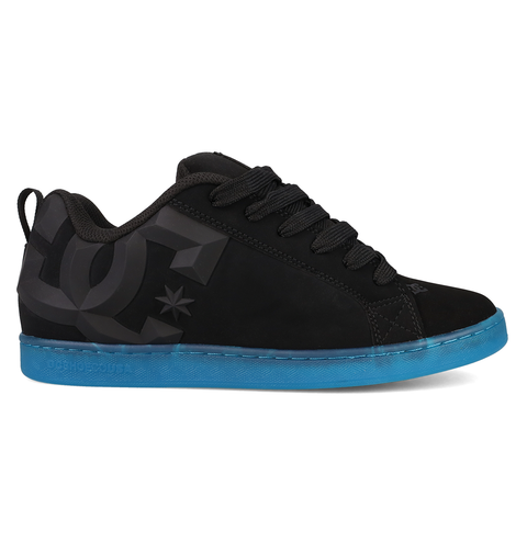 The Women’s Court Graffik Beveled Shoes by DC Shoes are black sneakers highlighted by a large dark gray DC logo on the side and a vibrant blue sole. Featuring a puffy silhouette, they are displayed from the side against a white background.