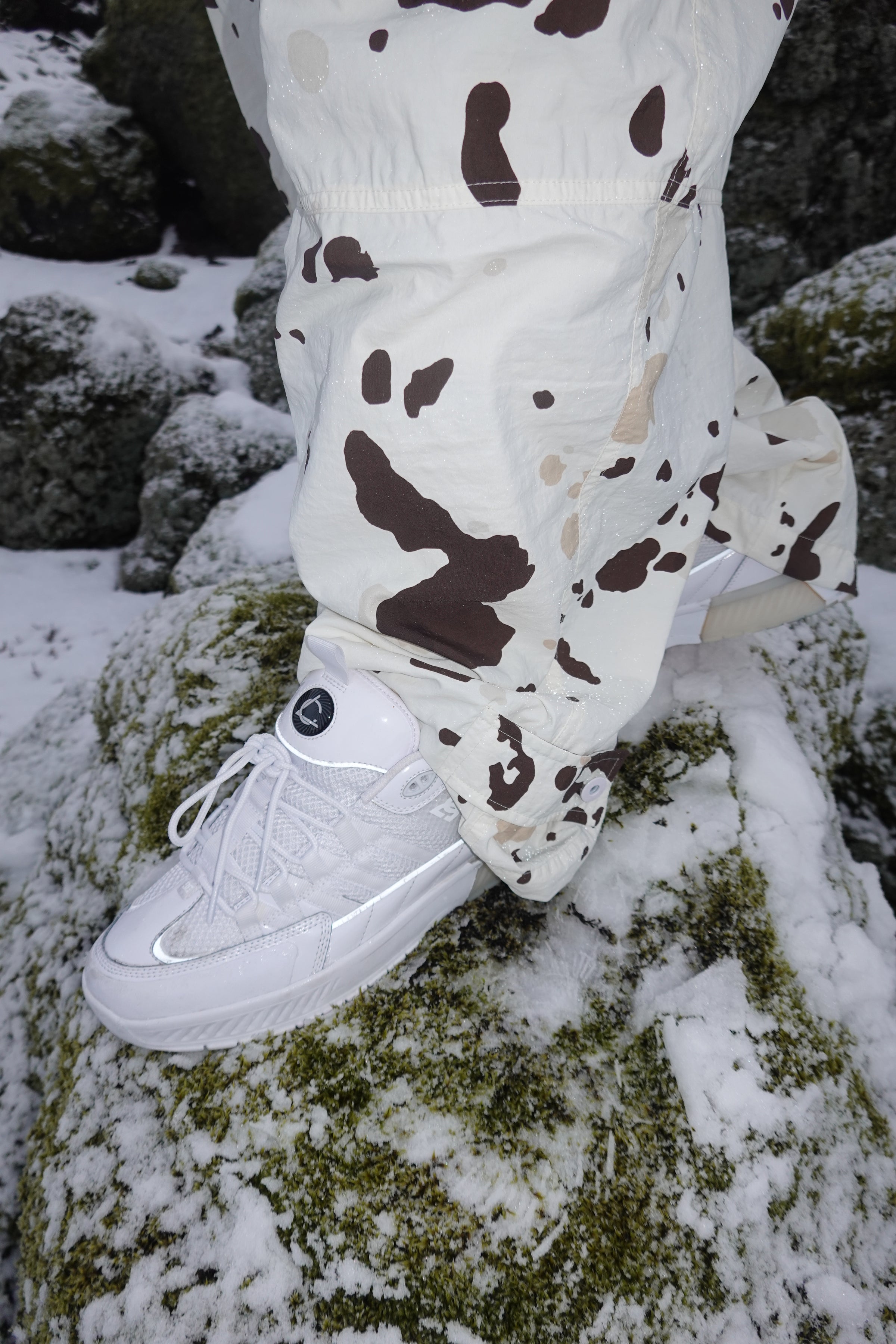 White Lucien shoes being worn in a wintery setting