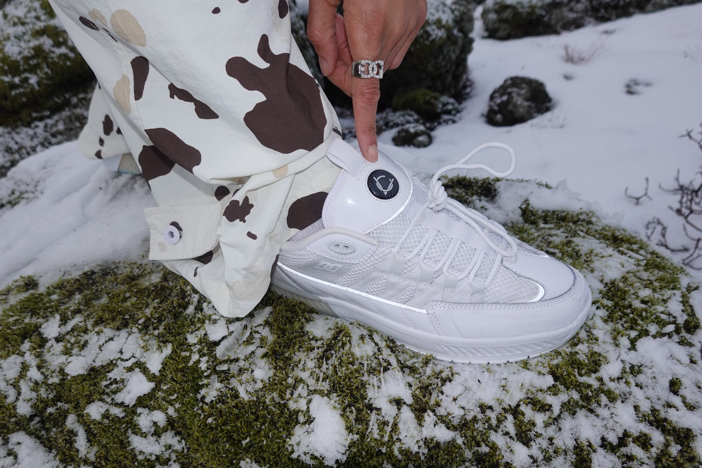 Lucien shoes in white in a wintery setting.