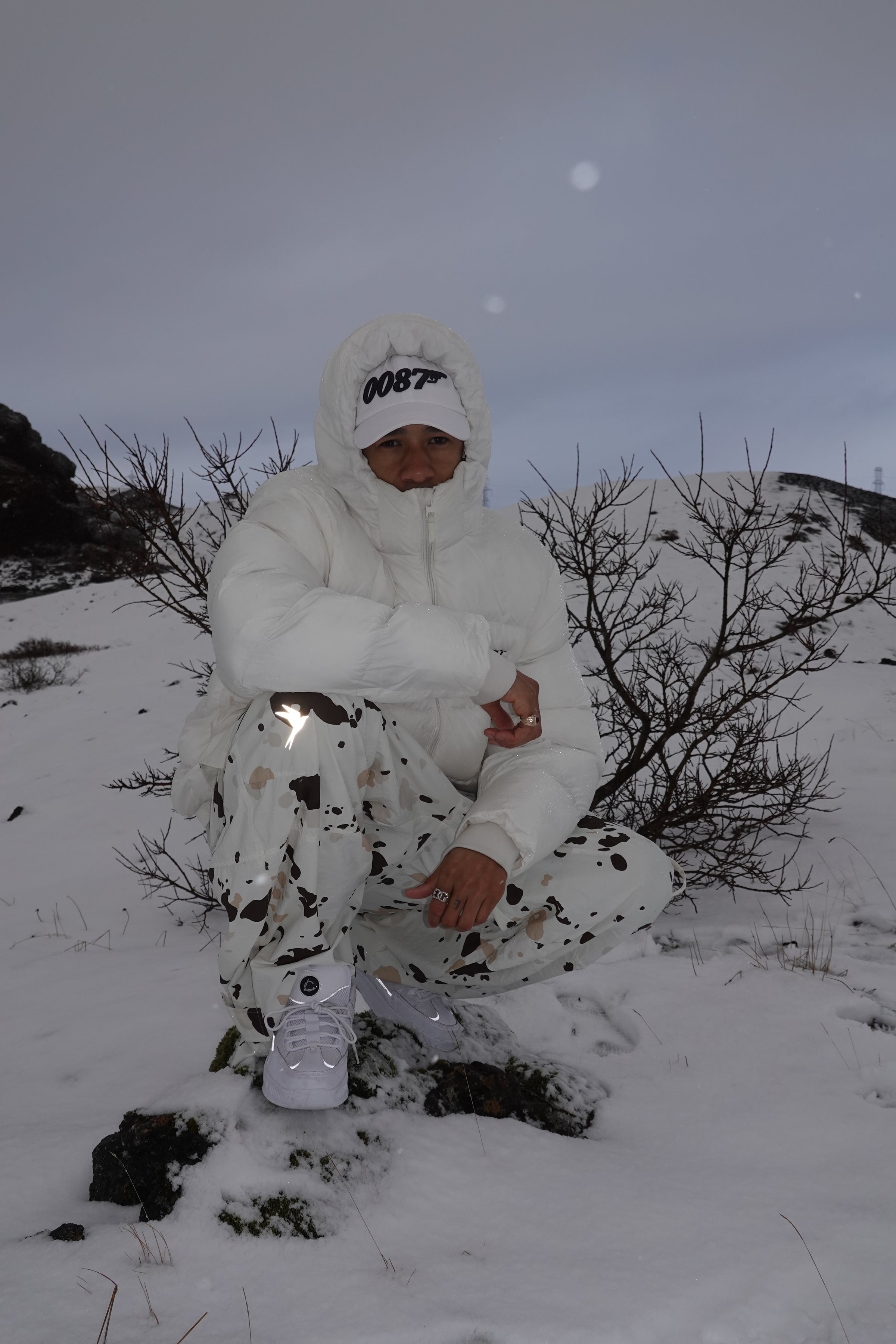White Lucien shoes being worn in a wintery setting